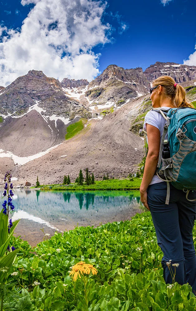 woman looking at view at Blue Lakes in Ridgway, Colorado